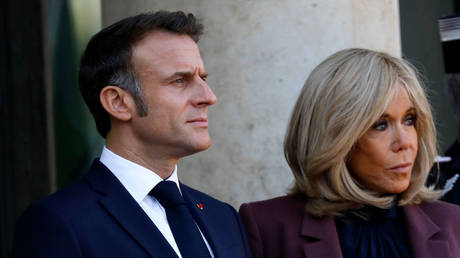 FILE PHOTO: French President Emmanuel Macron and his wife Brigitte Macron