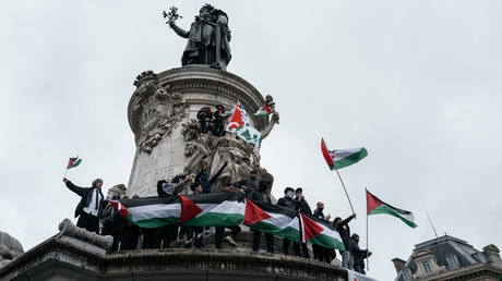 FILE PHOTO. Protesters wave Palestinian flags during a demonstration at the Place de la Republique in Paris on May 31, 2024.