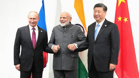 FILE PHOTO: Russian President Vladimir Putin, Indian Prime Minister Narendra Modi and Chinese President Xi Jinping.
