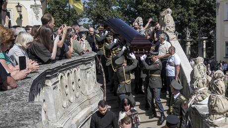Soldiers carry the coffin of former Ukrainian parliament speaker Andrey Parubiy, who was killed last Saturday in Lviv, Ukraine, Sept. 2, 2025.