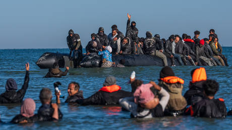 Migrants on a dinghy in the English Channel, headed to the UK, Gravelines, France, August 25, 2025.