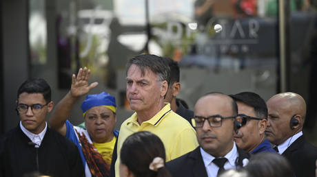 Brazil's former President Jair Bolsonaro leaves a hospital after undergoing medical examinations to return to house arrest before the trial, August 16, 2025.