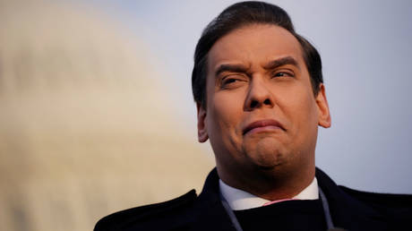 US Representative George Santos speaks to reporters on Thursday in Washington.