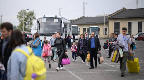 FILE PHOTO: Refugees from Ukraine board a coach to Warsaw.