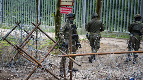 FILE PHOTO: Polish soldiers patrolling the border with Belarus.