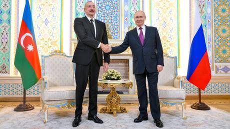 Azerbaijani President Ilham Aliyev and Russian President Vladimir Putin during a meeting at the Government Residence in Dushanbe.