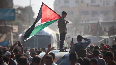 Buses carrying Palestinians released from Israeli prisons under a Gaza ceasefire and hostage exchange deal with Palestinian factions arrive outside the Nasser hospital in Khan Yunis, Gaza Strip, on October 13, 2025.