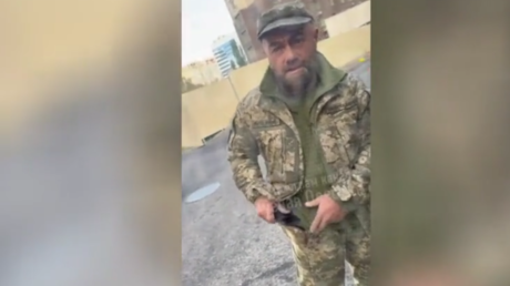 A screenshot from a video purporting to show suspected gang leader Magomed Aydamirov aiding Kiev’s mobilization campaign.