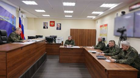 Russian President Vladimir Putin visits a Russian Army command post.