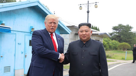 FILE PHOTO. North Korean leader Kim Jong-un and US President Donald Trump meet inside the demilitarized zone separating the South and North Korea on June 30, 2019.