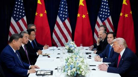 US President Donald Trump speaks with Chinese President Xi Jinping at Gimhae Air Base in Busan, South Korea, October 30, 2025.