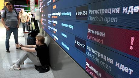 Departure board at the Sheremetyevo International Airport in Moscow showing cancelled flight amid hacker attack on Aeroflot.