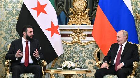 FILE PHOTO. Russian President Vladimir Putin and Syrian President Ahmed al-Sharaa during a meeting in Moscow.