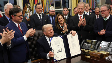 US President Donald Trump signs funding legislation to reopen the federal government at the White House in Washington, DC, on November 12, 2025.
