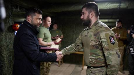 FILE PHOTO: Ukraine’s Vladimir Zelensky presenting decorations to troops.