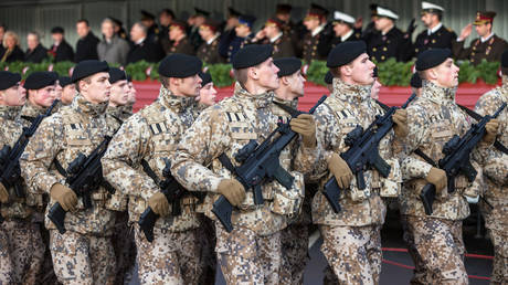 File photo: Latvian soldiers march in Riga, November 18, 2009.