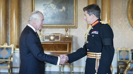 FILE PHOTO: Britain's King Charles III greets Major General Gwyn Jenkins, Vice Chief of Defence Staff during a meeting with military chiefs of staff at Buckingham Palace in London, September 17, 2022.