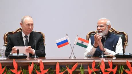 Russian President Vladimir Putin and Indian Prime Minister Narendra Modi attend a plenary session of the India-Russia Trade Forum in New Delhi, India.