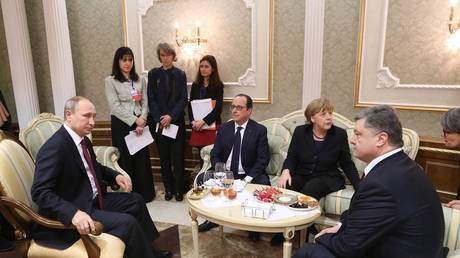 Left-to-right: then-leaders of Russia, France, Germany and Ukraine, Vladimir Putin, Francois Hollande, Angela Merkel, Pyotr Poroshenko, Minsk, Belarus, February 11, 2015.