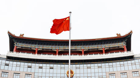 Chinese flag on a background of a modern building