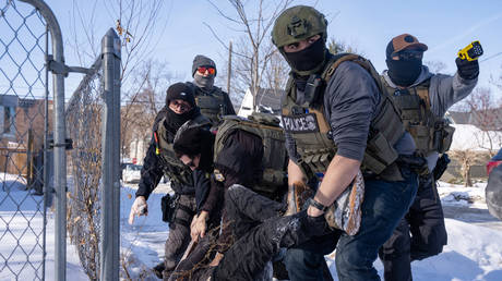 FILE PHOTO: US Federal immigration agents arrest a protester in Minneapolis, Minnesota, February 3, 2026.