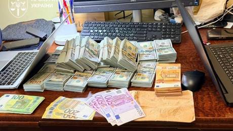 Money seized by Ukrainian investigators during raids on suspected corrupt police officials.