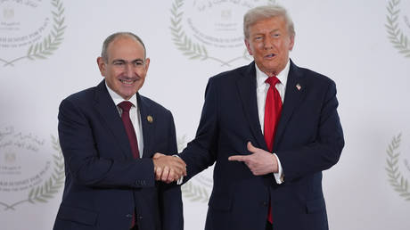US President Donald Trump greets Armenia's Prime Minister Nikol Pashinyan during a world leaders' summit on ending the Gaza war on October 13, 2025 in Sharm El-Sheikh, Egypt.
