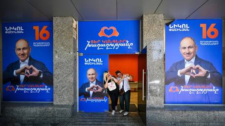 FILE PHOTO: Election campaign posters with an image of Civil Contract party leader and Prime Minister Nikol Pashinyan