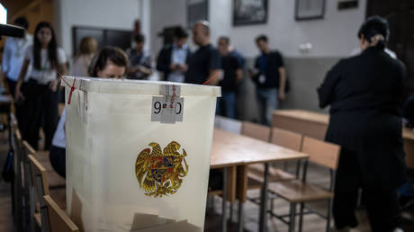 FILE PHOTO. Election officials count ballots in Armenia.