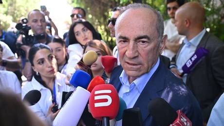 The opposition Armenia Alliance leader Robert Kocharyan talking to journalists after casting his ballot in Yerevan.