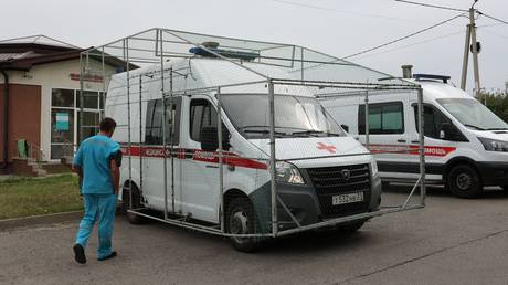 FILE PHOTO: A medic approaching an ambulance unit with anti-drone protection in Russia’s Belgorod Region.