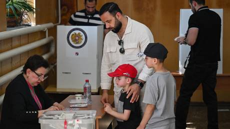 Voters cast ballots in Armenia's parliamentary elections in Yerevan, on June 7, 2026.